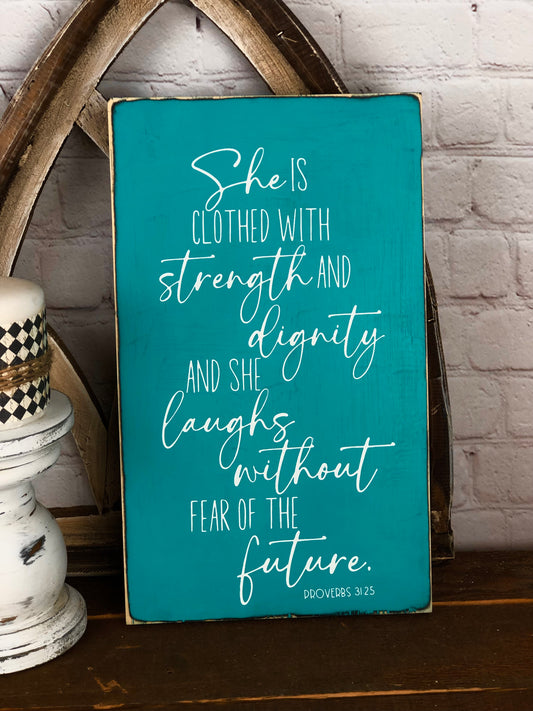 SHE IS CLOTHED WITH STRENGTH AND DIGNITY AND SHE LAUGHS WITHOUT FEAR OF THE FUTURE - WOOD SIGN