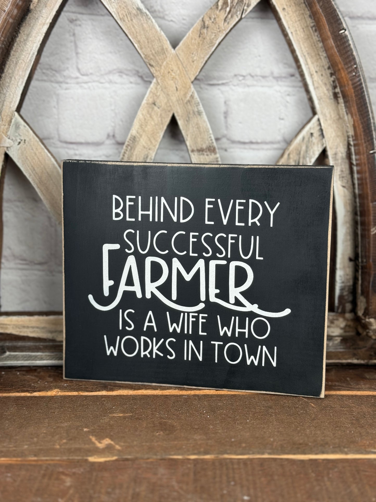 BEHIND EVERY SUCCESSFUL FARMER/RANCHER IS A WIFE WHO WORKS IN TOWN- WOOD SIGN